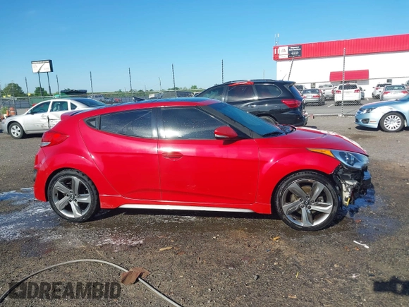 2013 Hyundai Veloster Turbo z VIN KMHTC6AE3DU169229, wystawiony jako IAAI lot #42087798 z przebiegiem 120 741 mil mil oraz . Historia ofert i sprzedaży dostępna na DreamBid. Obrazek 13.