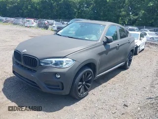 2016 BMW X6 xDrive35i z VIN 5UXKU2C5XG0N83220, wystawiony jako IAAI lot #39197569 z przebiegiem Nie podano mil oraz . Historia ofert i sprzedaży dostępna na DreamBid. Obrazek 17.