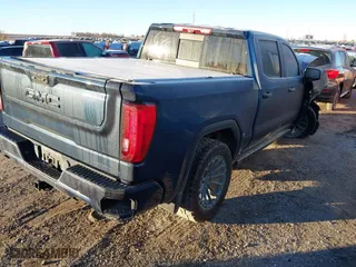 2023 GMC Sierra 1500 Denali Ultimate with VIN 1GTUUHEL8PZ169339, listed as a IAAI auction lot 40810905 with 26,566 mi miles. Bid and sale history available at carsss.com. Image 4.
