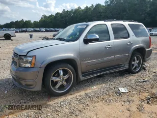 2011 Chevrolet Tahoe LTZ z VIN 1GNSCCE06BR263920, wystawiony jako Copart lot #57098645 z przebiegiem 177 901 mil mil oraz Szkoda całkowita • Salvage title. Historia ofert i sprzedaży dostępna na DreamBid. Obrazek 1.