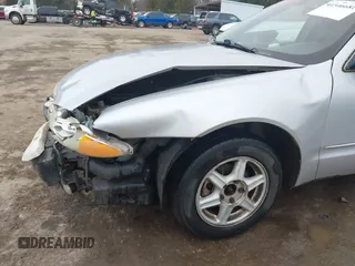 2003 Oldsmobile Alero GL1 z VIN 1G3NL52F43C169291, wystawiony jako IAAI lot #41546681 z przebiegiem 176 341 mil mil oraz . Historia ofert i sprzedaży dostępna na DreamBid. Obrazek 6.
