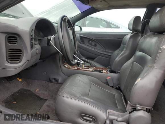 1997 Chrysler Sebring LXi z VIN 4C3AU52N2VE183090, wystawiony jako Copart lot #81855454 z przebiegiem 157 590 mil mil oraz Szkoda całkowita • Salvage title. Historia ofert i sprzedaży dostępna na DreamBid. Obrazek 7.