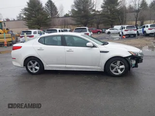 2015 Kia Optima LX with VIN KNAGM4A70F5571034, listed as a IAAI auction lot 41734211 with 214,948 mi miles. Bid and sale history available at carsss.com. Image 14.