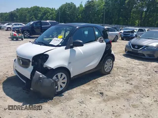 2016 Smart fortwo Passion z VIN WMEFJ5DA6GK078340, wystawiony jako IAAI lot #42140363 z przebiegiem 114 647 mil mil oraz . Historia ofert i sprzedaży dostępna na DreamBid. Obrazek 2.