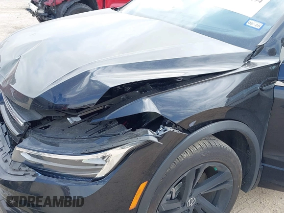 2023 Volkswagen Tiguan SE R-Line Black with VIN 3VVCB7AX0PM122636, listed as a IAAI auction lot 42040494 with 8,589 mi miles and . Bid and sale history available at DreamBid. Image 6.