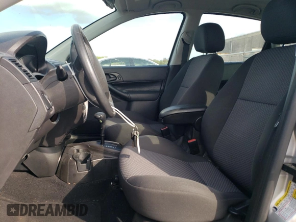 2007 Ford Focus S with VIN 1FAHP37N67W268162, listed as a Copart auction lot 71736384 with 69,391 mi miles and Salvage Title. Bid and sale history available at DreamBid. Image 7.