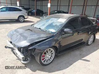 2015 Mitsubishi Lancer Evolution GSR z VIN JA32W8FV2FU020047, wystawiony jako IAAI lot #41890897 z przebiegiem 121 089 mil mil oraz . Historia ofert i sprzedaży dostępna na DreamBid. Obrazek 2.