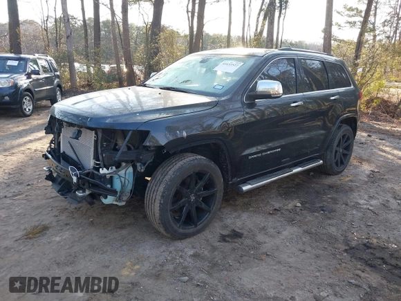 2015 Jeep Grand Cherokee Overland with VIN 1C4RJECGXFC957530, listed as a IAAI auction lot 41633522 with 168,258 mi miles and . Bid and sale history available at DreamBid. Image 2.