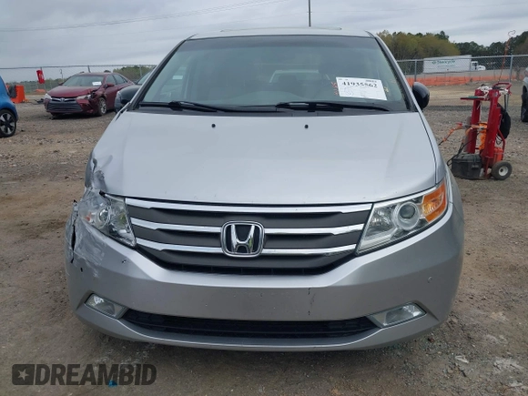 2012 Honda Odyssey Touring with VIN 5FNRL5H98CB026754, listed as a IAAI auction lot 41935562 with 165,626 mi miles. Bid and sale history available at carsss.com. Image 12.