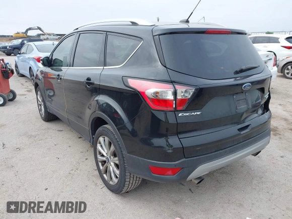 2017 Ford Escape Titanium with VIN 1FMCU0J93HUF10664, listed as a IAAI auction lot 41921588 with 88,377 mi miles. Bid and sale history available at carsss.com. Image 3.