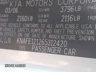 2006 Kia Spectra EX with VIN KNAFE121265312420, listed as a IAAI auction lot 42085732 with 59,641 mi miles. Bid and sale history available at carsss.com. Image 9.