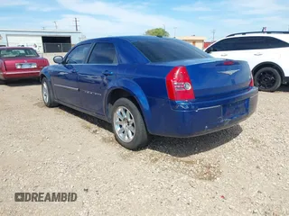 2009 Chrysler 300 Touring with VIN 2C3LA53V89H512049, listed as a IAAI auction lot 41883948 with 167,923 mi miles. Bid and sale history available at carsss.com. Image 3.
