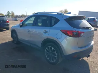 2016 Mazda CX-5 Grand Touring z VIN JM3KE2DY3G0712249, wystawiony jako IAAI lot #37910910 z przebiegiem 262 058 mil mil oraz . Historia ofert i sprzedaży dostępna na DreamBid. Obrazek 3.