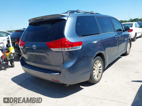 2014 Toyota Sienna XLE with VIN 5TDYK3DC5ES481399, listed as a IAAI auction lot 42085550 with 154,157 mi miles. Bid and sale history available at carsss.com. Image 4.