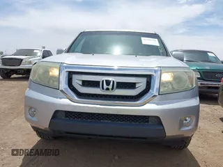 2011 Honda Pilot Touring z VIN 5FNYF3H90BB006634, wystawiony jako IAAI lot #42388390 z przebiegiem 218 475 mil mil oraz . Historia ofert i sprzedaży dostępna na DreamBid. Obrazek 12.
