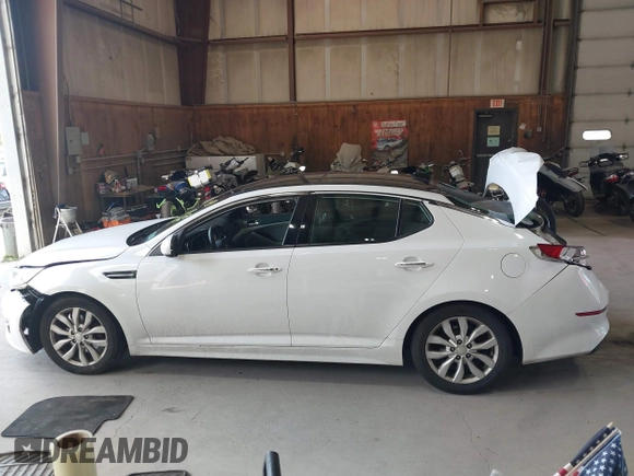 2015 Kia Optima EX z VIN 5XXGN4A7XFG415028, wystawiony jako IAAI lot #42635519 z przebiegiem 232 507 mil mil oraz . Historia ofert i sprzedaży dostępna na DreamBid. Obrazek 13.