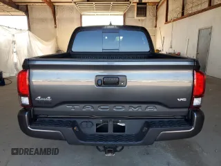 2023 Toyota Tacoma SR z VIN 3TMCZ5AN4PM599664, wystawiony jako Copart lot #57462455 z przebiegiem 65 736 mil mil oraz Szkoda całkowita • Salvage title. Historia ofert i sprzedaży dostępna na DreamBid. Obrazek 6.