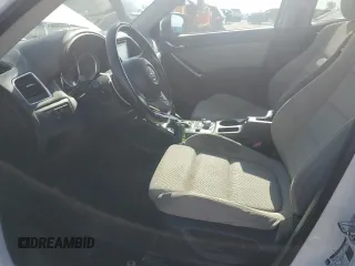 2016 Mazda CX-5 Touring z VIN JM3KE2CYXG0683673, wystawiony jako Copart lot #56724025 z przebiegiem 107 293 mil mil oraz Szkoda całkowita • Salvage title. Historia ofert i sprzedaży dostępna na DreamBid. Obrazek 7.