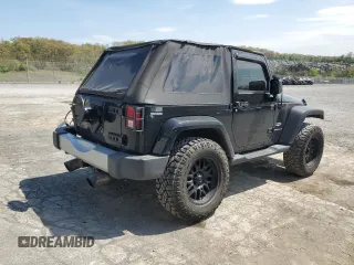 2011 Jeep Wrangler Sahara with VIN 1J4AA5D14BL542912, listed as a Copart auction lot 65158784 with 122,795 mi miles and Salvage Title. Bid and sale history available at DreamBid. Image 3.