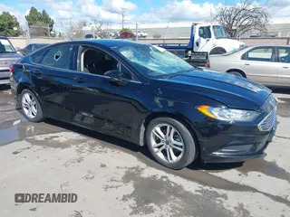 2018 Ford Fusion SE z VIN 3FA6P0HD4JR189255, wystawiony jako IAAI lot #41742122 z przebiegiem 100 330 mil mil oraz . Historia ofert i sprzedaży dostępna na DreamBid. Obrazek 1.