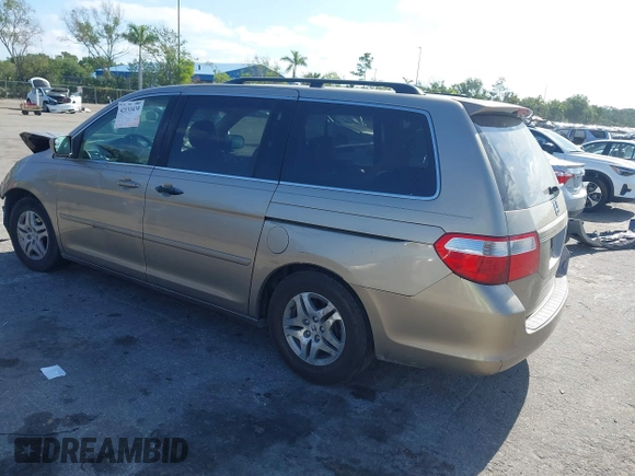 2005 Honda Odyssey EX with VIN 5FNRL38495B401742, listed as a IAAI auction lot 42133434 with 162,161 mi miles and . Bid and sale history available at carsss.com. Image 3.