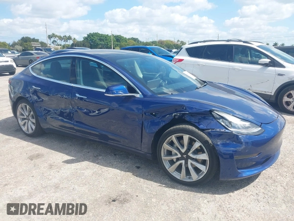 2020 Tesla Model 3 Standard Range Plus z VIN 5YJ3E1EA6LF785622, wystawiony jako IAAI lot #42080180 z przebiegiem 34 133 mil mil oraz . Historia ofert i sprzedaży dostępna na DreamBid. Obrazek 1.