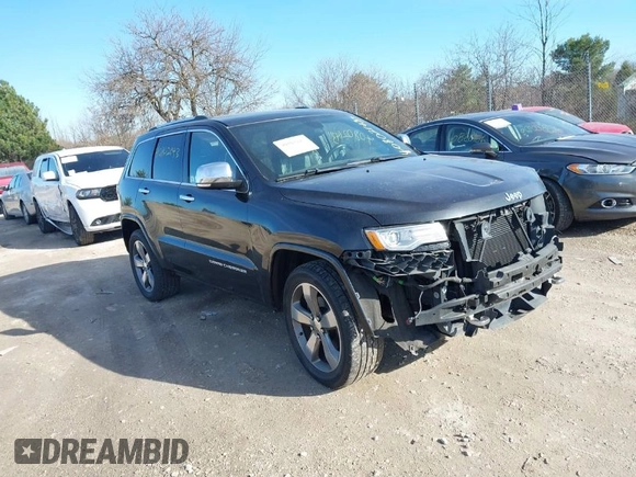 2014 Jeep Grand Cherokee Overland with VIN 1C4RJECG4EC523747, listed as a IAAI auction lot 40802143 with 124,079 mi miles. Bid and sale history available at carsss.com. Image 1.