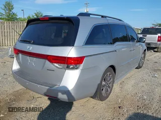 2014 Honda Odyssey Touring with VIN 5FNRL5H95EB108427, listed as a IAAI auction lot 39992643 with 100,658 mi miles and . Bid and sale history available at DreamBid. Image 4.