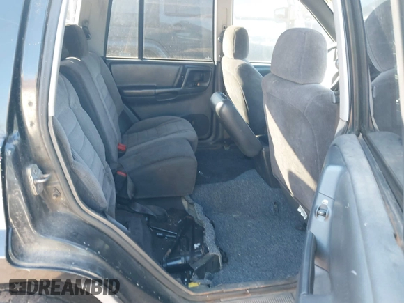 1998 Jeep Grand Cherokee Laredo with VIN 1J4FX58S7WC283734, listed as a IAAI auction lot 41267813 with 266,189 mi miles. Bid and sale history available at carsss.com. Image 8.