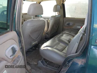 1997 GMC Yukon with VIN 1GKEK13R1VJ723409, listed as a IAAI auction lot 41512184 with 235,988 mi miles. Bid and sale history available at carsss.com. Image 8.
