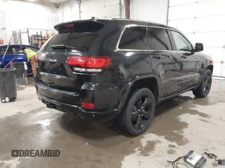 2015 Jeep Grand Cherokee Laredo with VIN 1C4RJFAG3FC115444, listed as a IAAI auction lot 41248211 with 138,828 mi miles. Bid and sale history available at carsss.com. Image 4.
