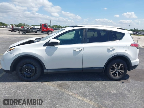 2018 Toyota RAV4 XLE with VIN 2T3WFREV9JW490324, listed as a IAAI auction lot 42298261 with 167,727 mi miles and . Bid and sale history available at DreamBid. Image 14.
