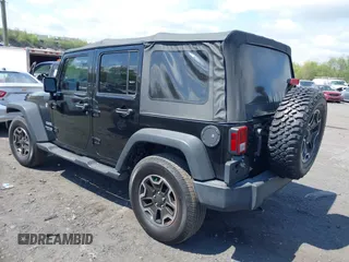 2018 Jeep Wrangler JK Unlimited Sport S with VIN 1C4BJWDG9JL816592, listed as a IAAI auction lot 42187279 with 91,169 mi miles. Bid and sale history available at carsss.com. Image 3.