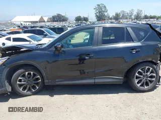 2016 Mazda CX-5 Grand Touring z VIN JM3KE2DY6G0900005, wystawiony jako IAAI lot #42311162 z przebiegiem 80 758 mil mil oraz . Historia ofert i sprzedaży dostępna na DreamBid. Obrazek 15.
