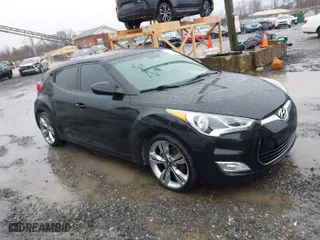 2012 Hyundai Veloster w/Gray Int with VIN KMHTC6AD1CU033106, listed as a IAAI auction lot 41528193 with 47,215 mi miles. Bid and sale history available at carsss.com. Image 1.