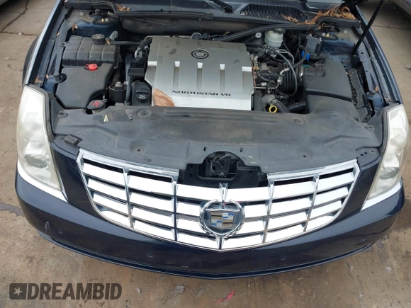 2009 Cadillac DTS 1SA z VIN 1G6KD57Y19U137656, wystawiony jako IAAI lot #41531439 z przebiegiem 103 151 mil mil oraz . Historia ofert i sprzedaży dostępna na DreamBid. Obrazek 10.