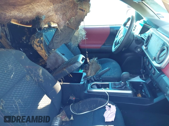 2021 Toyota Tacoma SR z VIN 5TFCZ5AN3MX272033, wystawiony jako IAAI lot #41689129 z przebiegiem Nie podano mil oraz . Historia ofert i sprzedaży dostępna na DreamBid. Obrazek 5.