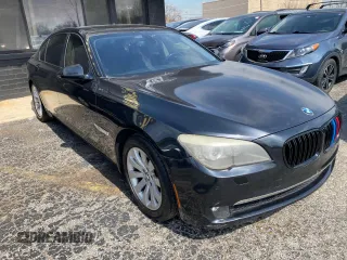 2012 BMW 7 Series 740Li with VIN WBAKB4C55CC576166, listed as a Copart auction lot 52448115 with 154,949 mi miles and Clean Title. Bid and sale history available at carsss.com. Image 1.