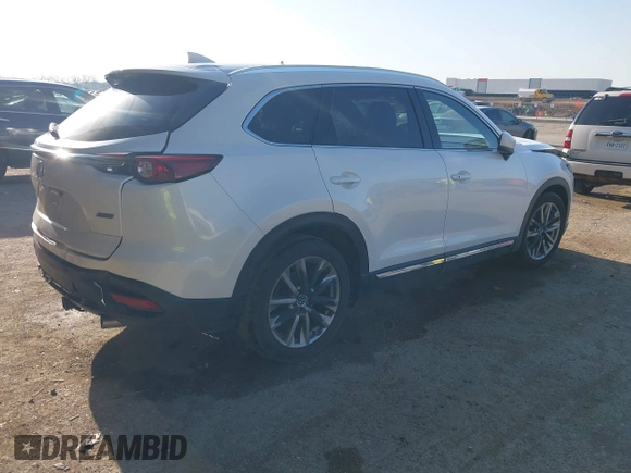 2016 Mazda CX-9 Grand Touring z VIN JM3TCADY6G0125547, wystawiony jako IAAI lot #41997445 z przebiegiem 129 179 mil mil oraz . Historia ofert i sprzedaży dostępna na DreamBid. Obrazek 4.