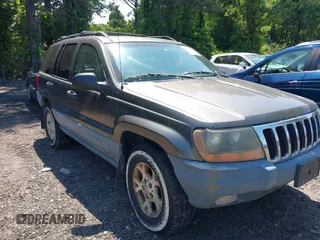 2000 Jeep Grand Cherokee Laredo z VIN 1J4GW48S8YC380039, wystawiony jako IAAI lot #42510307 z przebiegiem 215 776 mil mil oraz . Historia ofert i sprzedaży dostępna na DreamBid. Obrazek 1.