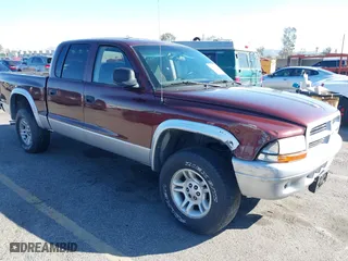 2002 Dodge Dakota SLT with VIN 1B7HG48Z52S605390, listed as a IAAI auction lot 41670007 with 238,351 mi miles. Bid and sale history available at carsss.com. Image 1.