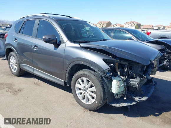 2016 Mazda CX-5 Touring with VIN JM3KE2CY4G0695947, listed as a IAAI auction lot 41824490 with 162,191 mi miles and . Bid and sale history available at carsss.com. Image 1.