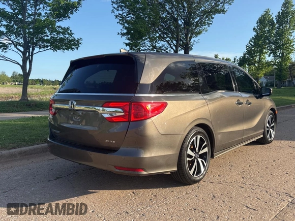 2020 Honda Odyssey Elite with VIN 5FNRL6H99LB004073, listed as a Copart auction lot 54796285 with 167,110 mi miles and Clean Title. Bid and sale history available at DreamBid. Image 4.