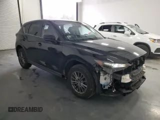 2021 Mazda CX-5 Touring with VIN JM3KFBCMXM0338844, listed as a Copart auction lot 53201615 with 137,498 mi miles and Clean Title. Bid and sale history available at carsss.com. Image 4.