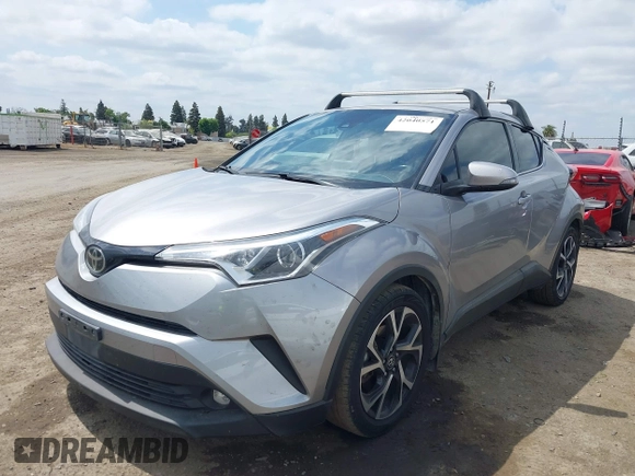 2019 Toyota C-HR XLE with VIN JTNKHMBX3K1016723, listed as a IAAI auction lot 42040571 with 158,804 mi miles. Bid and sale history available at carsss.com. Image 14.