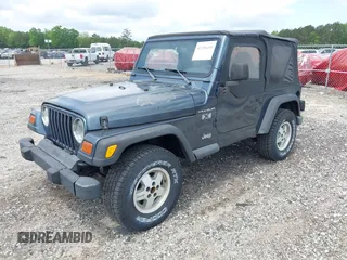 2002 Jeep Wrangler X with VIN 1J4FA39S92P736825, listed as a IAAI auction lot 42156410 with 196,313 mi miles. Bid and sale history available at carsss.com. Image 2.