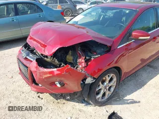 2014 Ford Focus Titanium z VIN 1FADP3N22EL381967, wystawiony jako IAAI lot #42782495 z przebiegiem 160 503 mil mil oraz . Historia ofert i sprzedaży dostępna na DreamBid. Obrazek 6.
