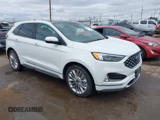 2021 Ford Edge Titanium z VIN 2FMPK3K94MBA05983, wystawiony jako IAAI lot #41965066 z przebiegiem 67 169 mil mil oraz . Historia ofert i sprzedaży dostępna na DreamBid. Obrazek 1.