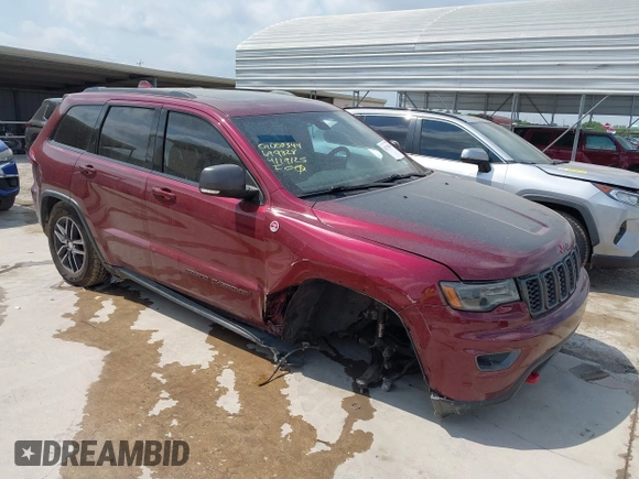 2017 Jeep Grand Cherokee Trailhawk with VIN 1C4RJFLG3HC699828, listed as a IAAI auction lot 42135444 with 98,596 mi miles and . Bid and sale history available at DreamBid. Image 1.