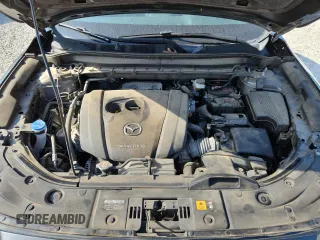 2020 Mazda CX-5 Grand Touring z VIN JM3KFADM2L0803589, wystawiony jako Copart lot #61916825 z przebiegiem 63 663 mil mil oraz Szkoda całkowita • Salvage title. Historia ofert i sprzedaży dostępna na DreamBid. Obrazek 12.